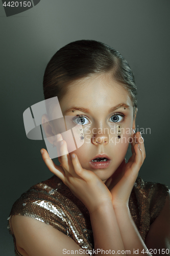 Image of The fashion portrait of young beautiful teen girl at studio