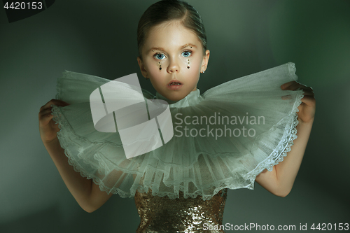 Image of The fashion portrait of young beautiful teen girl at studio