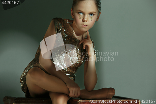 Image of The fashion portrait of young beautiful teen girl at studio
