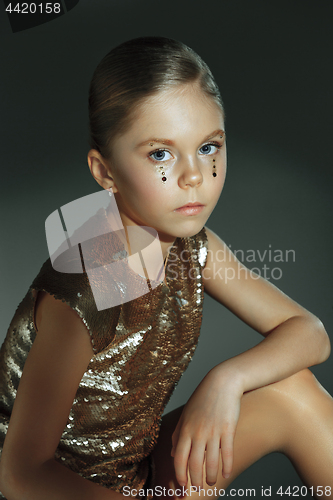 Image of The fashion portrait of young beautiful teen girl at studio