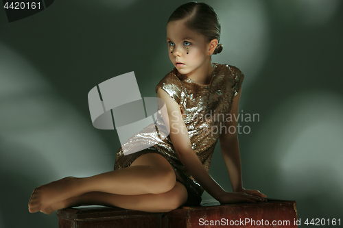 Image of The fashion portrait of young beautiful teen girl at studio