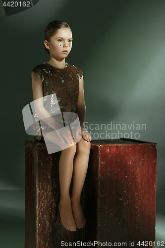 Image of The fashion portrait of young beautiful teen girl at studio