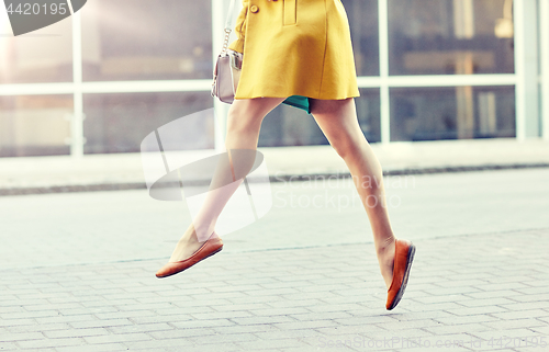 Image of young woman or teenage girl legs on city street