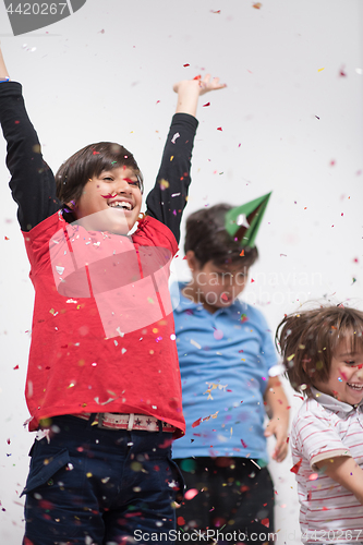 Image of kids  blowing confetti