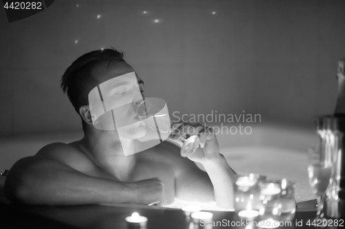 Image of man relaxing in the jacuzzi