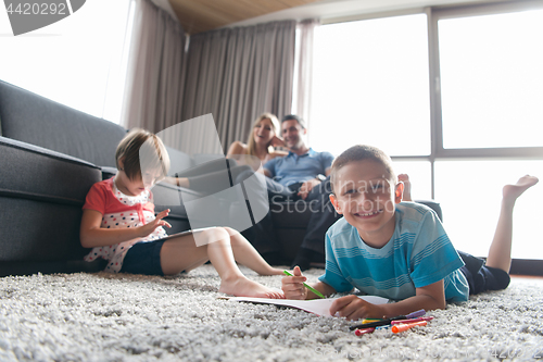 Image of young couple spending time with kids