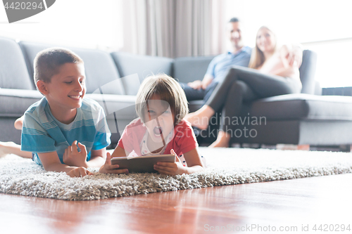 Image of couple spending time with kids