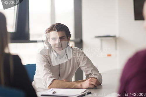 Image of Group of young people meeting in startup office