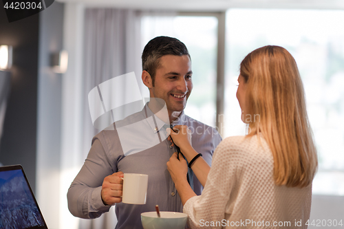 Image of A young couple is preparing for a job and using a laptop