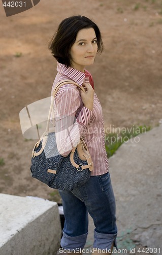 Image of pretty brunet woman with bag