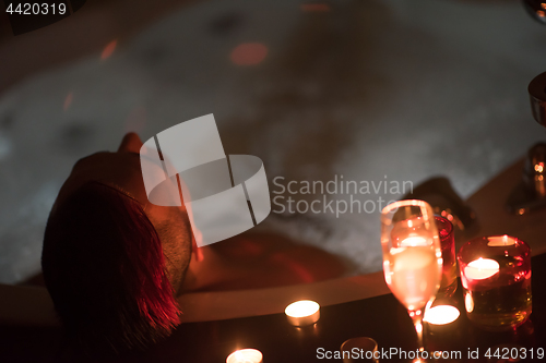 Image of man relaxing in the jacuzzi