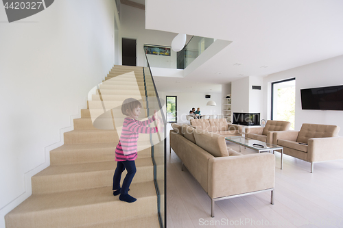 Image of family with little girl enjoys in the modern living room