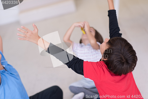 Image of young boys having fun on the floor