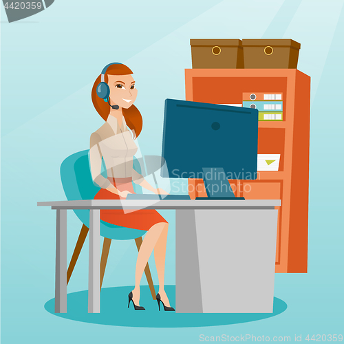 Image of Business woman with headset working at office.