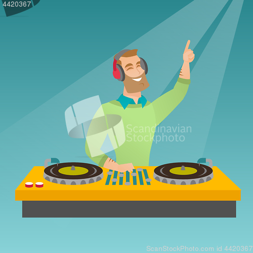 Image of DJ mixing music on the turntables.