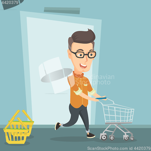 Image of Male customer running into the shop with trolley.