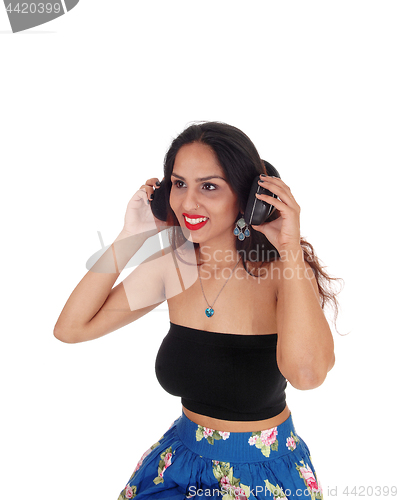 Image of Young woman listening to music