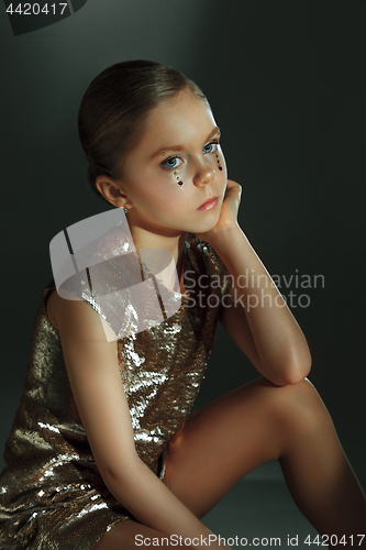 Image of The fashion portrait of young beautiful teen girl at studio