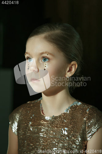 Image of The fashion portrait of young beautiful teen girl at studio