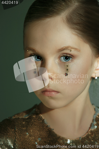 Image of The fashion portrait of young beautiful teen girl at studio