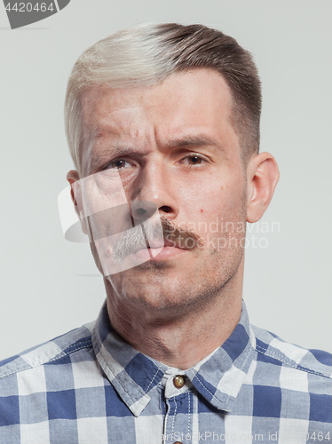 Image of Collage of two portraits of the same old man and young man. Face lifting, aging and skincare concept.