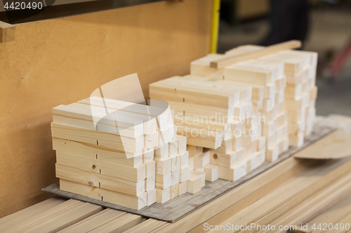 Image of wooden boards at workshop or woodworking plant