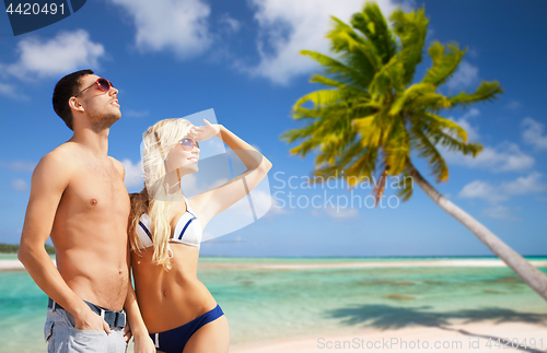 Image of happy couple on over exotic tropical beach