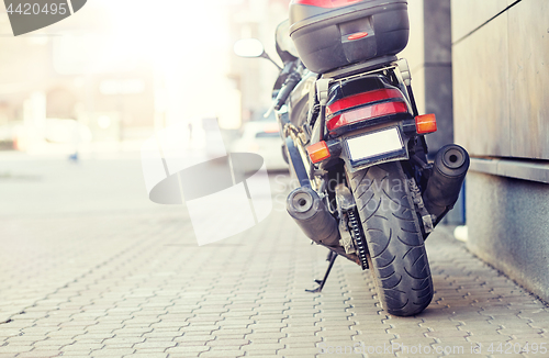 Image of close up of motorcycle parked on city street