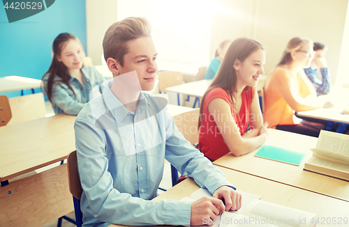 Image of happy student boy at school lesson