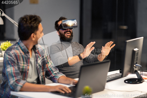 Image of developers with virtual reality headset at office