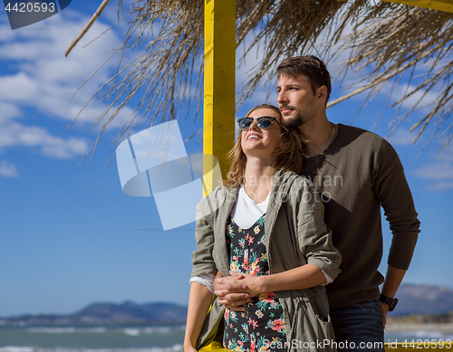 Image of Couple chating and having fun at beach bar