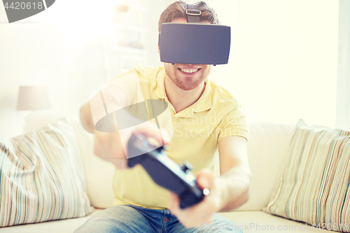 Image of man in virtual reality headset with controller