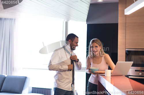 Image of A young couple is preparing for a job and using a laptop