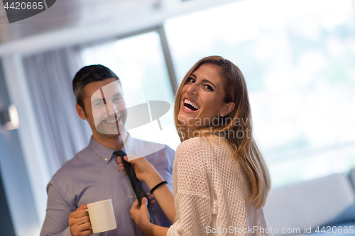 Image of A young couple is preparing for a job and using a laptop