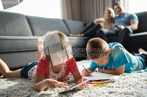 Image of young couple spending time with kids