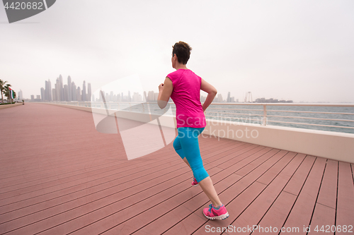 Image of woman running on the promenade