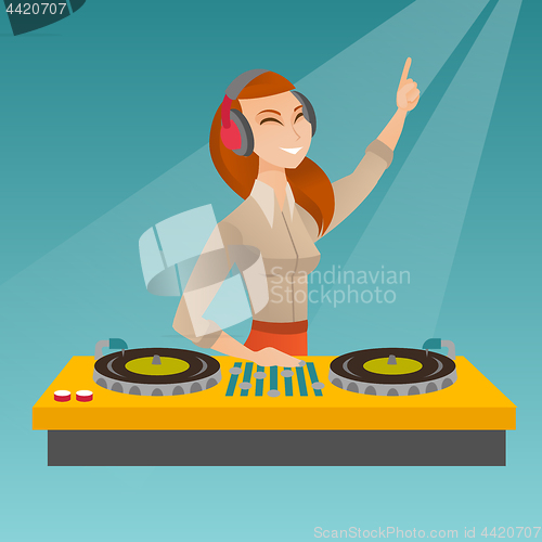 Image of DJ mixing music on the turntables.