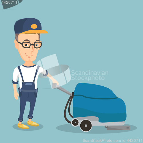 Image of Man cleaning the store floor with a machine.