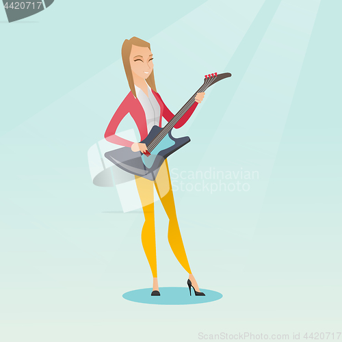 Image of Woman playing the electric guitar.