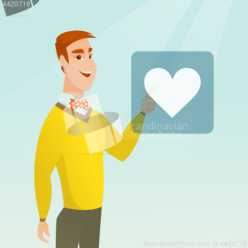 Image of Young man pressing heart shaped button.