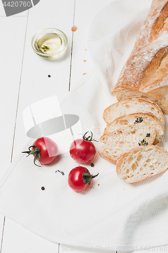 Image of The fresh bread on a white table background