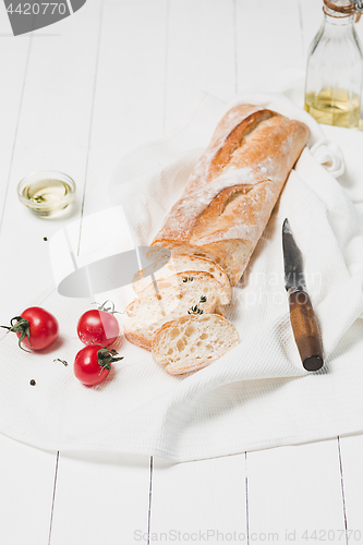 Image of The fresh bread on a white table background