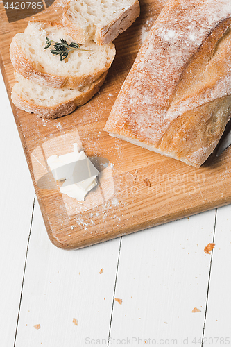 Image of The fresh bread on a white table background