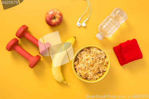 Image of Healthy lifestyle flat lay on yellow background