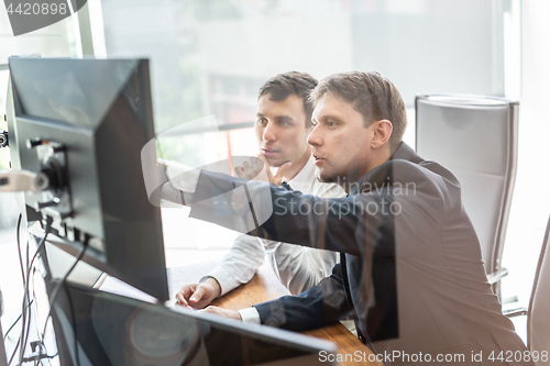 Image of Business team analyzing data at business meeting.