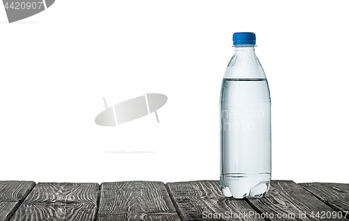 Image of Plastic bottle of water on the table