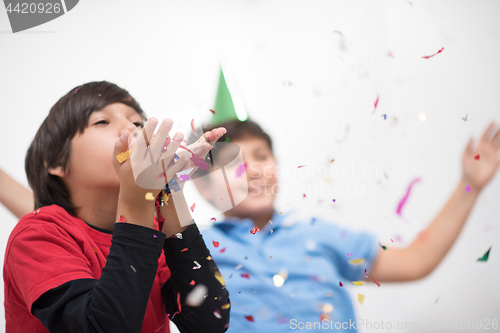 Image of kids  blowing confetti