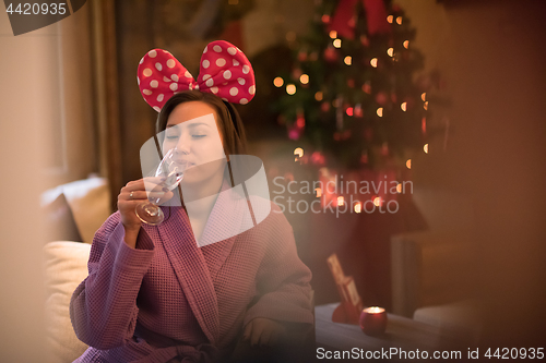 Image of woman drinking champagne at spa