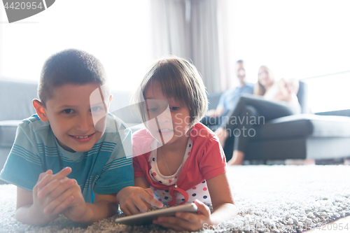 Image of couple spending time with kids