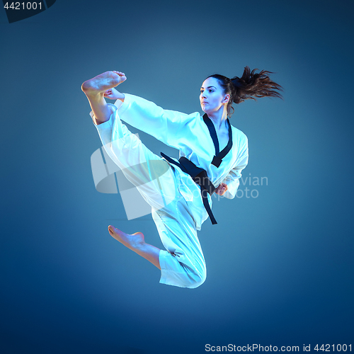 Image of The karate girl with black belt